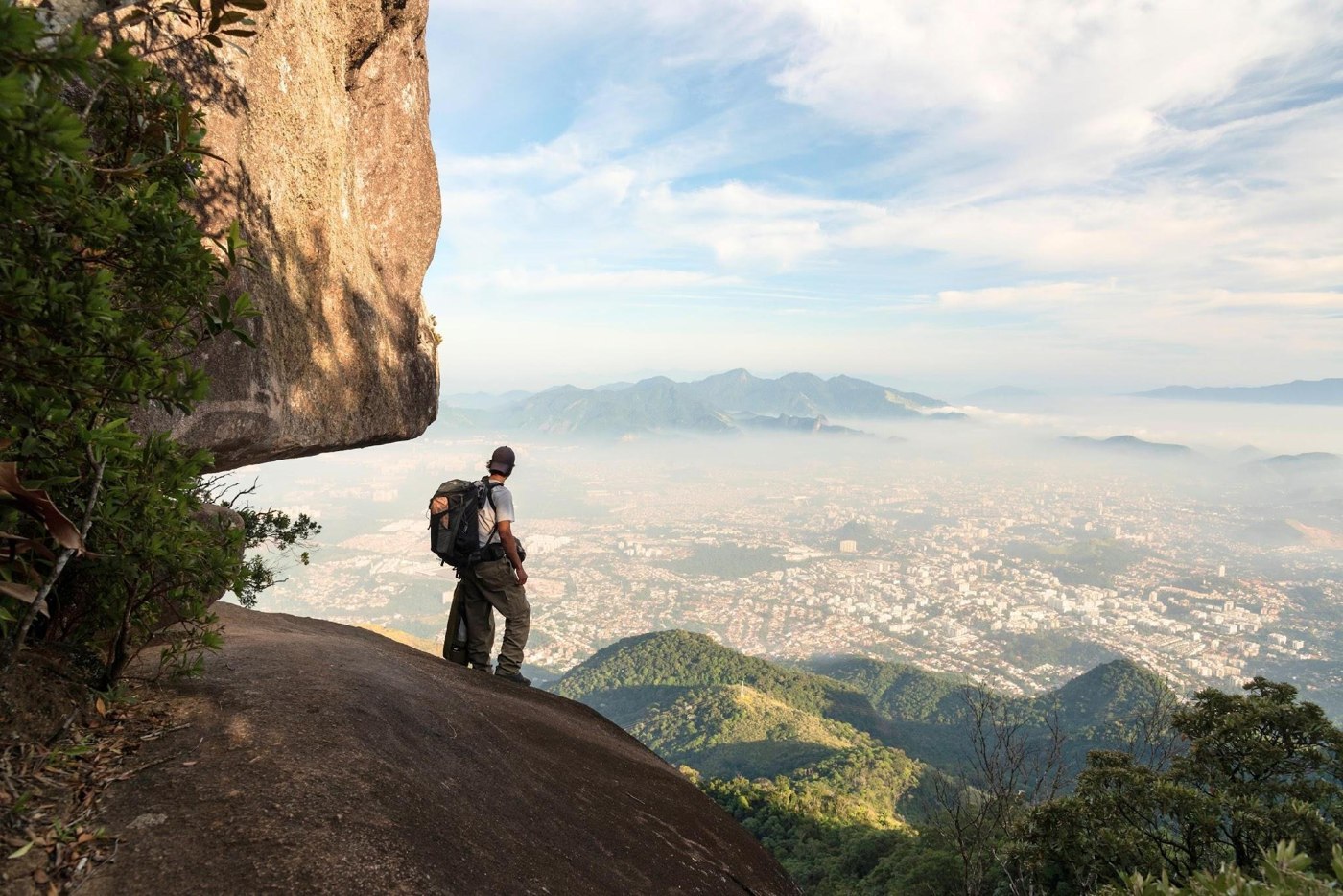 A traveller looking out over a mountain landscape